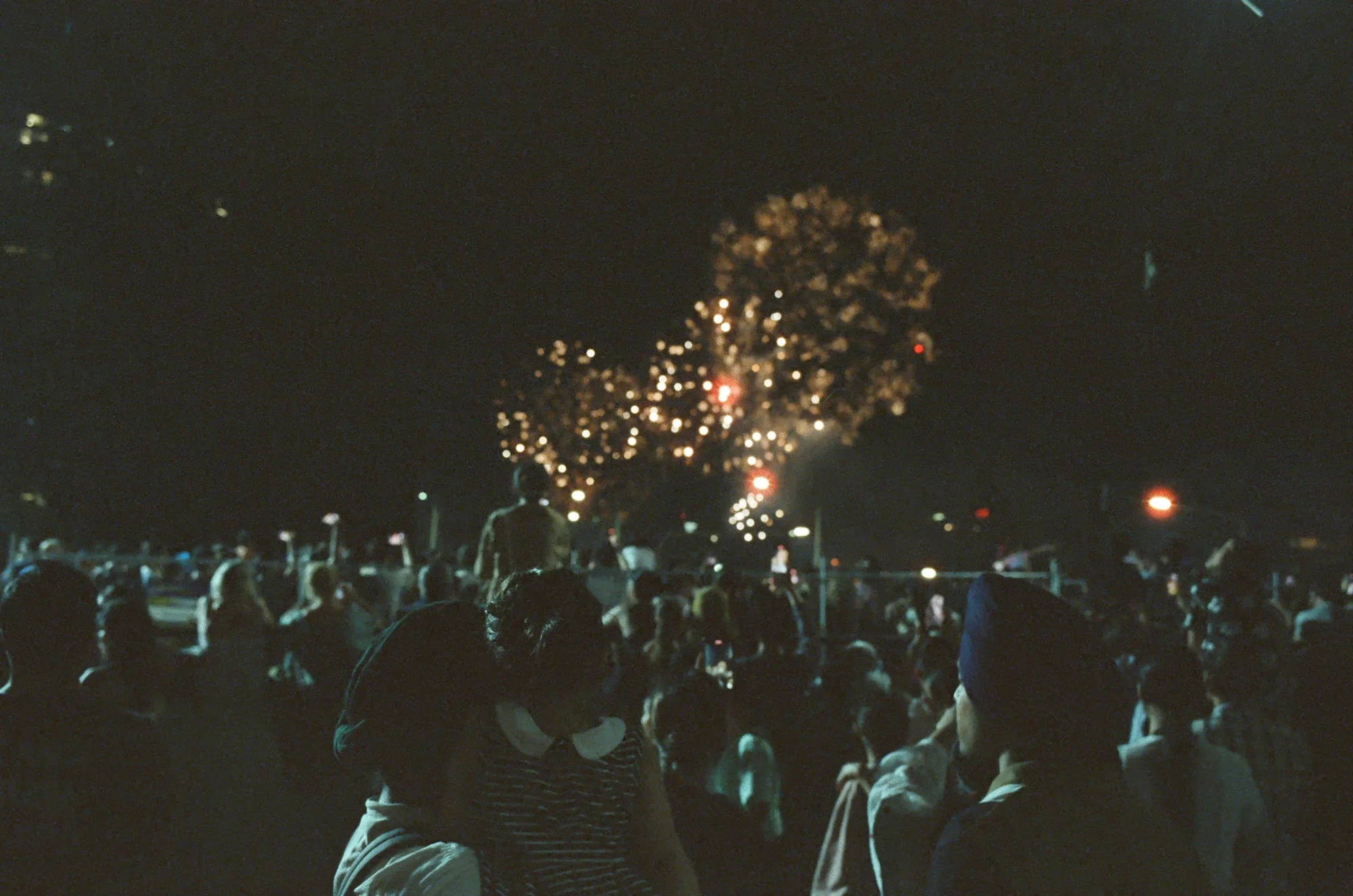 Golden fireworks as a family watches on